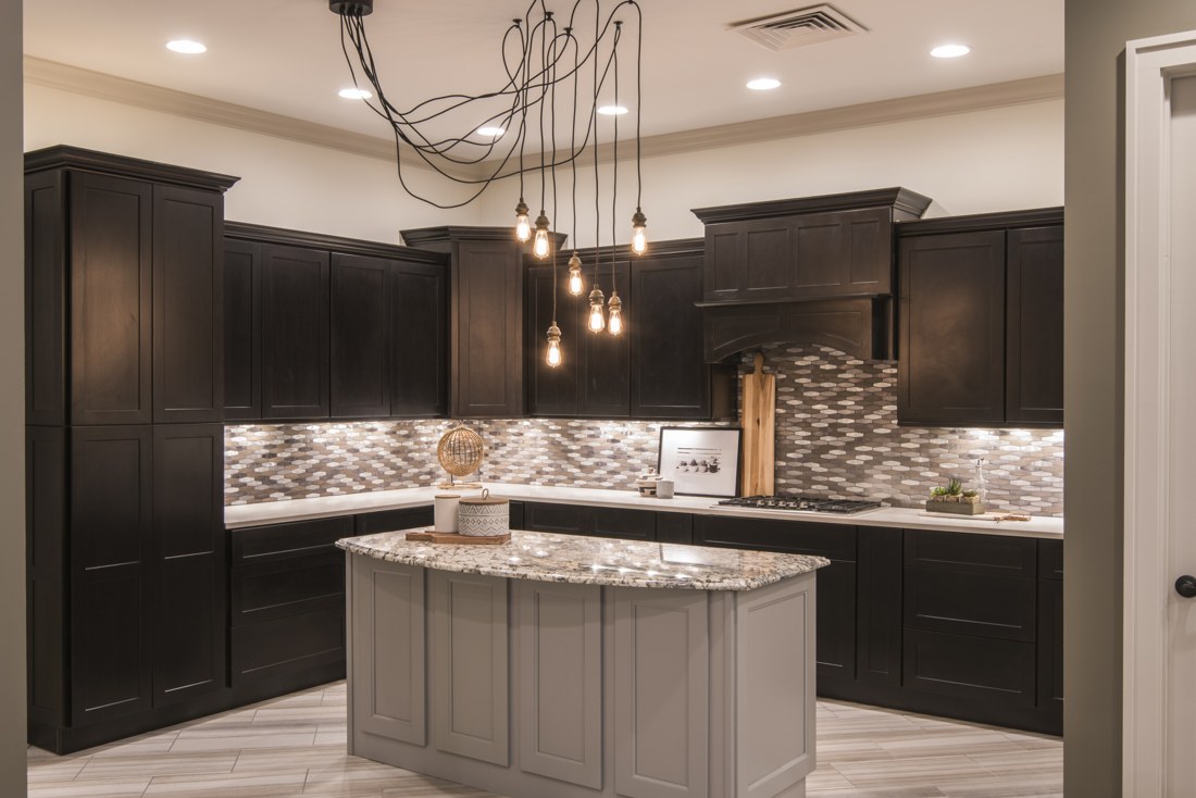 Dark cabinetry and a contrasting light island in the CIDC showroom
