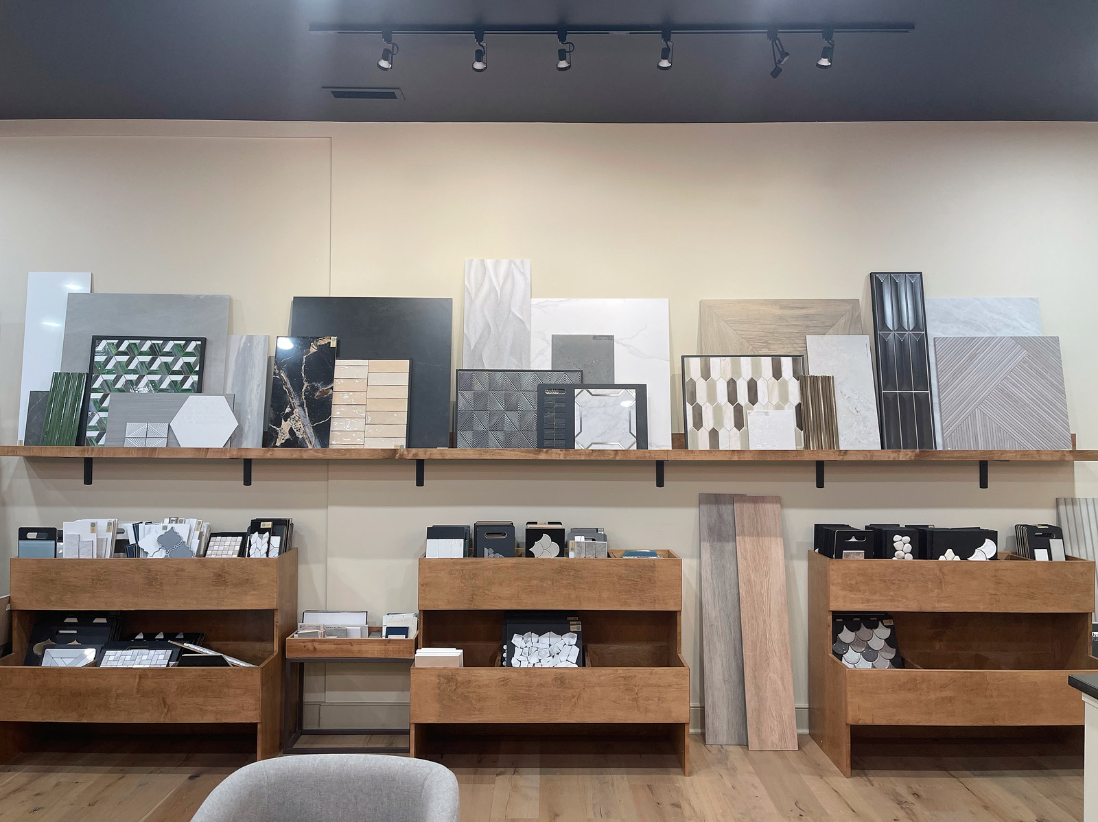 Tile sample boards and selection racks inside the CIDC showroom
