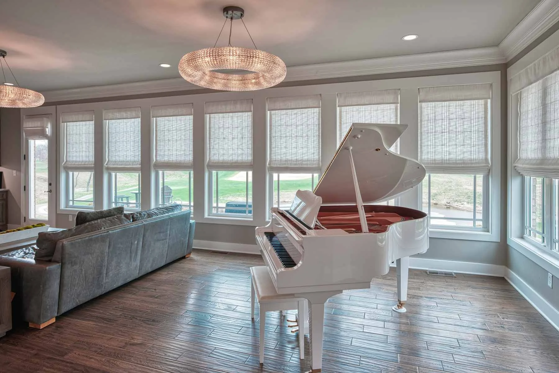 Fabric Roman shades across a bright living room
